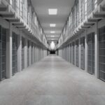 Rows of prison cells, prison interior.