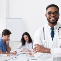 African Medical Doctor Looking At Camera During Conference