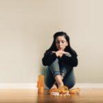 Caucasian female contemplating take prescription pills Caucasian female contemplating take prescription pills