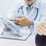 Doctor consultation with the patient by using digital tablet Doctor consultation with the patient by using digital tablet