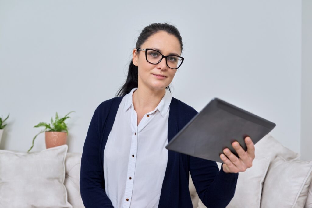 Business woman talking online using video call on digital tablet