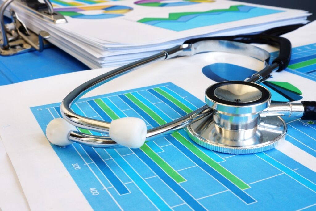 Stethoscope on a financial report. Business analysis and audit.