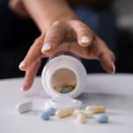 Drug Addicted Woman Reaching For Medication Drug Addicted Woman Reaching For Medication