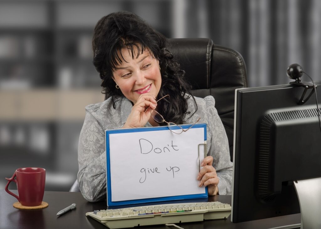 Female psychiatrist holds written message Do not give up