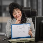 Female psychiatrist holds written message Do not give up Female psychiatrist holds written message Do not give up